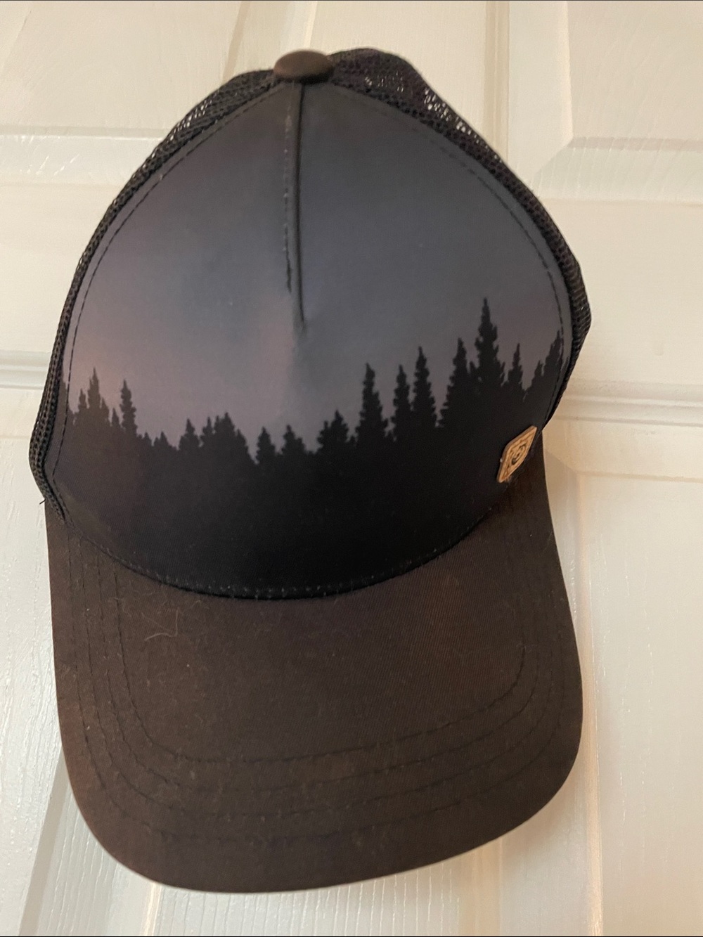 tentree Black Trucker Hat with Forest Silhouette